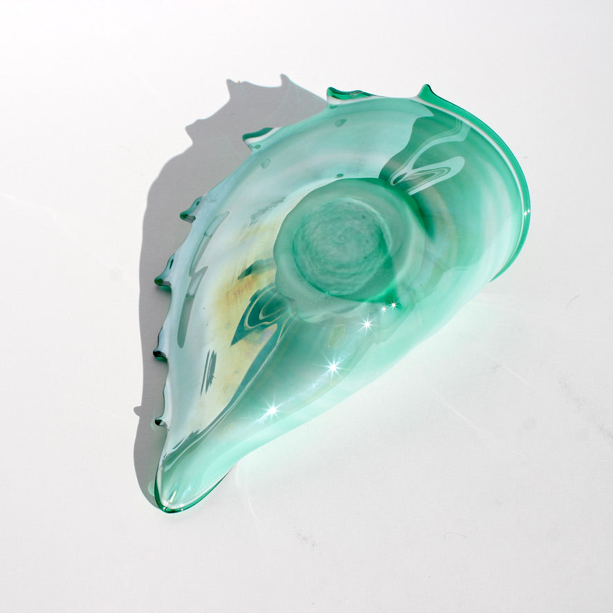 iridescent green glass shell