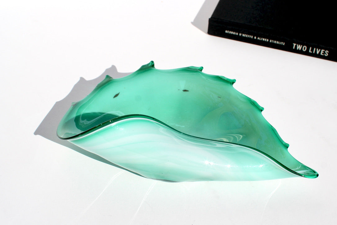 iridescent green glass shell